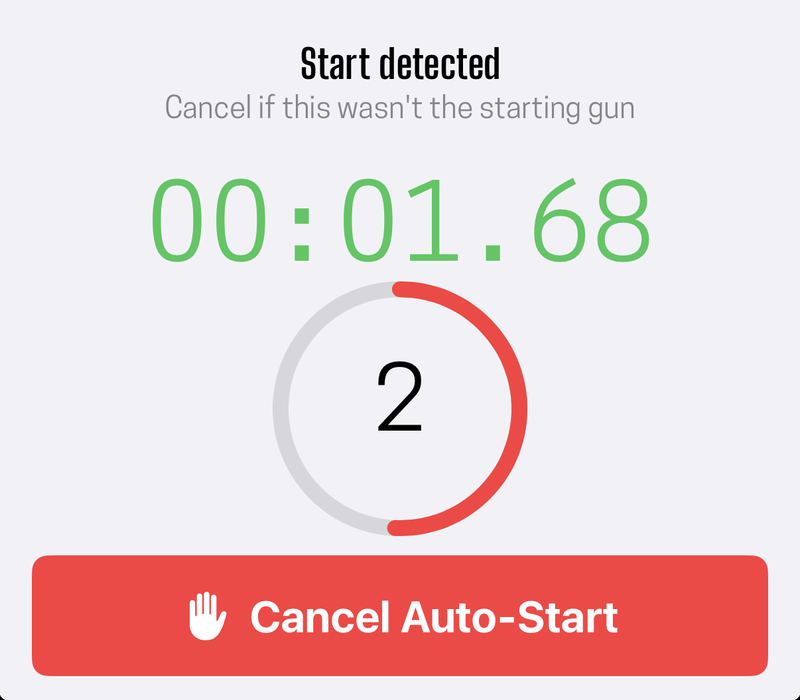 The countdown holding a detected start, with the clock already running behind it